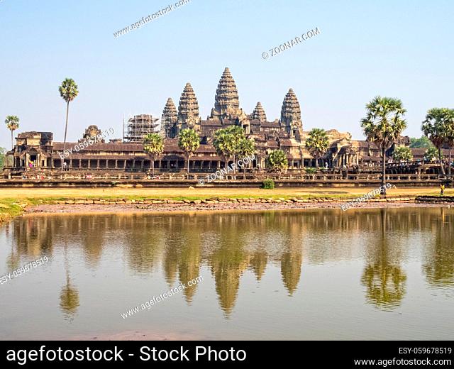 The iconic towers of Angkor Wat and the lake at the west gate - Siem reap, Cambodia