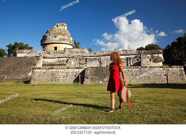 Woman posing in front of the El Caracol in Chichen Itza Ruins, Chichen Itza, Yucatan Province, Mexico, Central America