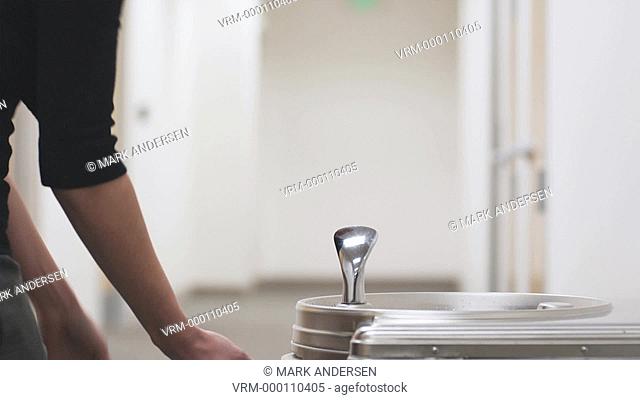 woman using a drinking fountain