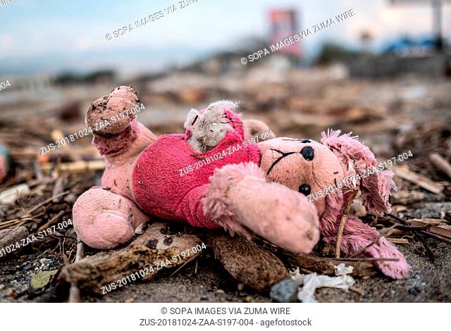 October 24, 2018 - Palu, Indonesia - A doll seen lying on the Talise beach area after the earthquake and tsunami..A deadly earthquake measuring 7