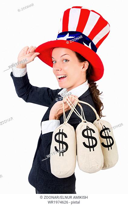 Businesswoman with sacks of money on white