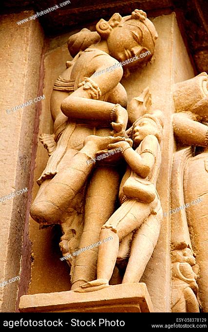 Stone statue of gracious lady showing the thorn struck on her foot at Khajuraho in Madhya Pradesh, India, Asia