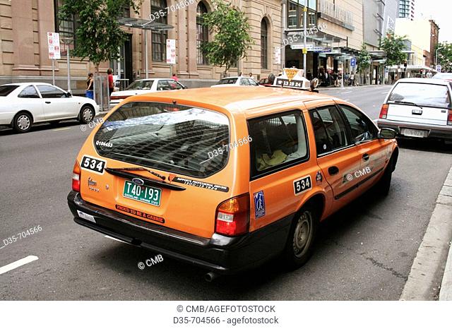 Orange cab, public transport, taxi in Brisbane, Edward St, East Coast, Queensland, Australia