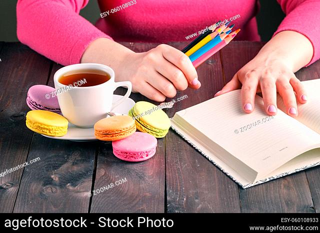 Pack of colorful pencils in woman hands