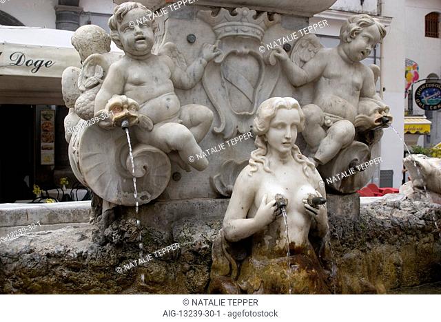 The Baroque Fountain of Sant'Andrea with its unique water taps, Amalfi, Amalfi Coast, Campania, Italy