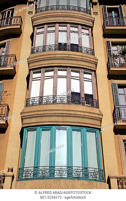 glass windows in modernist building of Gran Via de Les Corts Catalanes, Barcelona, Catalonia, Spain