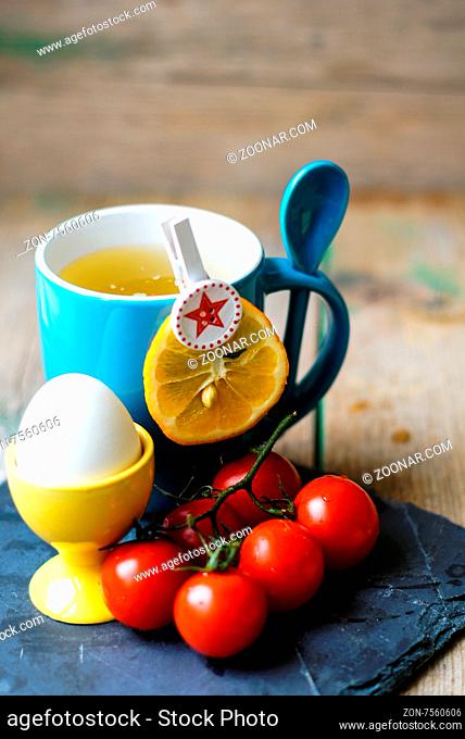 Healthy breakast with eggs, tea and tomatoes