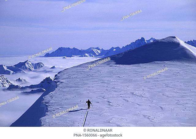 Dutch mountaineer Ronald Naar ascending the last meters of an unclimbed peak in the mountains of eastern Greenland