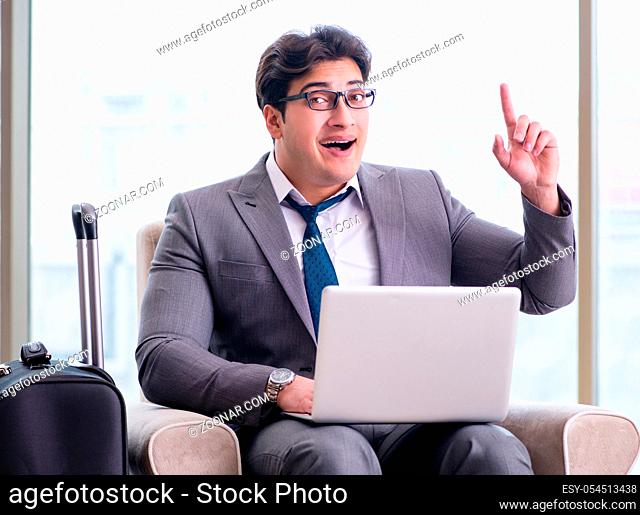 The young businessman in airport business lounge waiting for flight