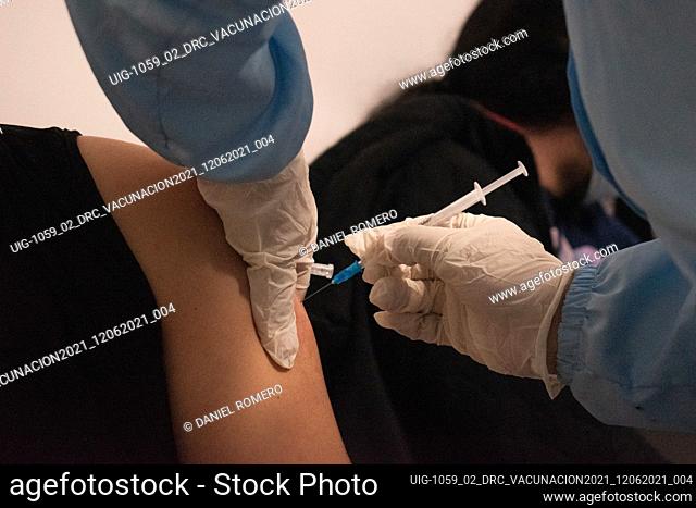 People get the Pfizer and BioNtech vaccine against the novel Coronavirus disease (COVID-19) that now vaccinates people over the age of 50, in Bogota