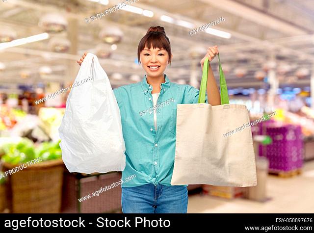 woman with plastic and reusable shopping bag