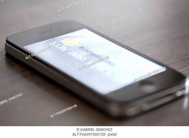Smartphone displaying image of credit card