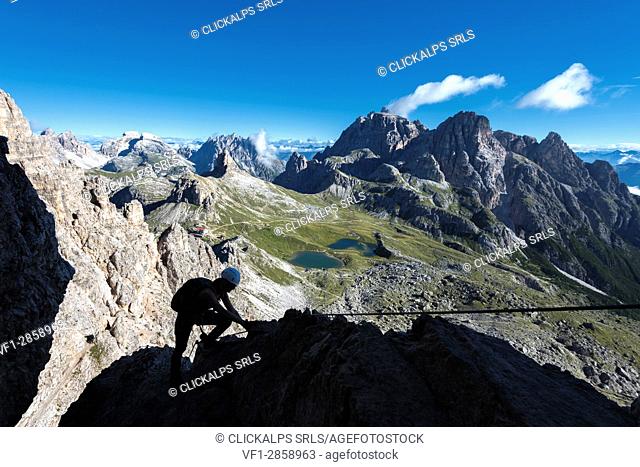 Sesto/Sexten, Dolomites, South Tyrol, province of Bolzano, Italy. Climber on the via ferrata De Luca-Innerkofler to the summit of Monte Paterno