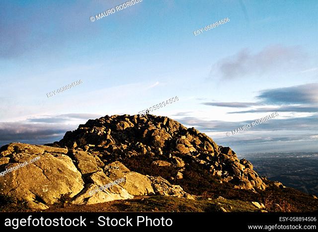 View of a landscape featuring a pile of rocks on top of Monchique mountain in Portugal