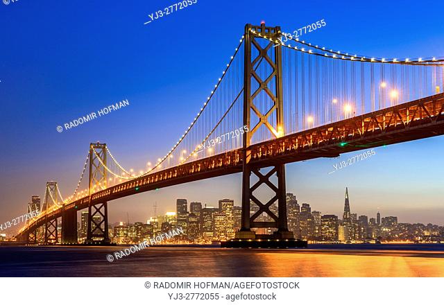 The Bay Bridge and San Francisco skyline at dusk