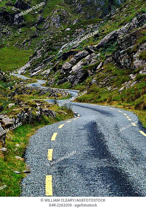 Narrow road winding through the Ballaghbeama Gap, County Kerry, Ireland