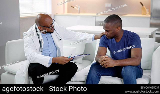 Doctor Talking With African Patient. Medical Caregiver