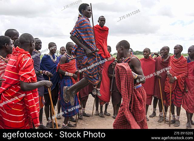Masai men in traditional dress demonstrating their jumping skills. Masai Village, Amboseli National Park