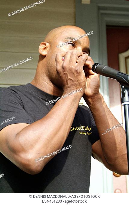 Male musicians play guitar and harmonica