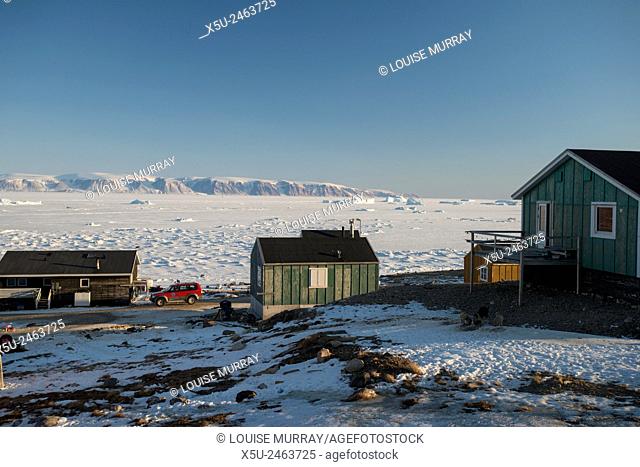 Colourful wooden houses in the village of Qaanaaq, one of the most northerly human settlements on the planet and home to 656 mostly Inuit people