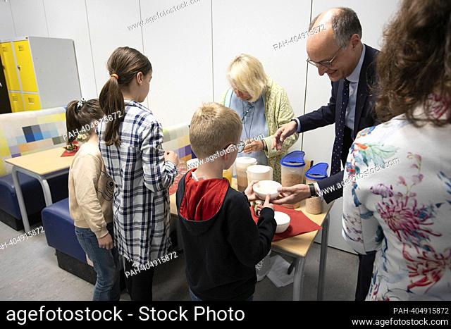 Students having breakfast, Dr. Urban MAUER, Secretary of State in the Ministry of Schools and Education of the State of North Rhine-Westphalia, pours muesli