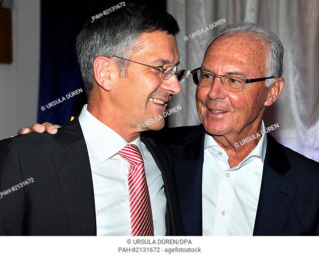 Herbert Hainer, CEO of Adidas AG (l), and football legend Franz Beckenbauer, enjoying the gala that is being held as part of the 29th Kaiser Cup golf tournament