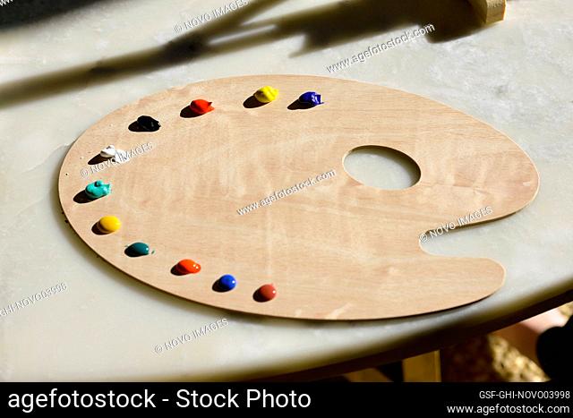 Child's Wood Painting Palette with Dollops of Paint Colors
