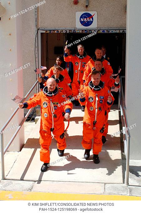 FILE: In this photo released by NASA, , the STS-121 crew displays the spirit of the Fourth of July holiday with their flags and their eagerness to launch as...