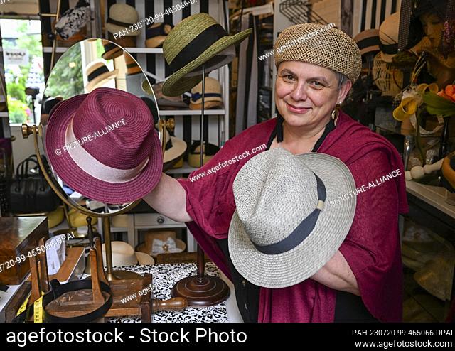 19 July 2023, Berlin: In her studio in the Günzelkiez in Wilmersdorf, milliner Petra Benz shows Panama and summer hats that offer additional UV protection...