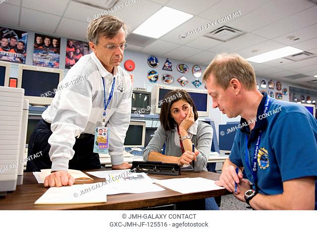 Canadian Space Agency astronaut Robert Thirsk (standing), Expedition 2021 flight engineer; European Space Agency astronaut Frank De Winne