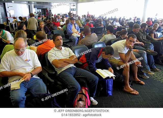 Florida, Miami, Miami International Airport, MIA, gate area, passengers, man, woman, Hispanic, crowded, waiting, delays