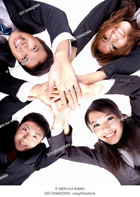 Asian Young Business people joining their hands