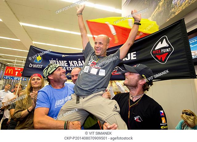 Czech climber Radek Jaros (second from right) arrives at the Vaclav Havel Airport from the Himalayas where he ascended the world's second highest peak, K2
