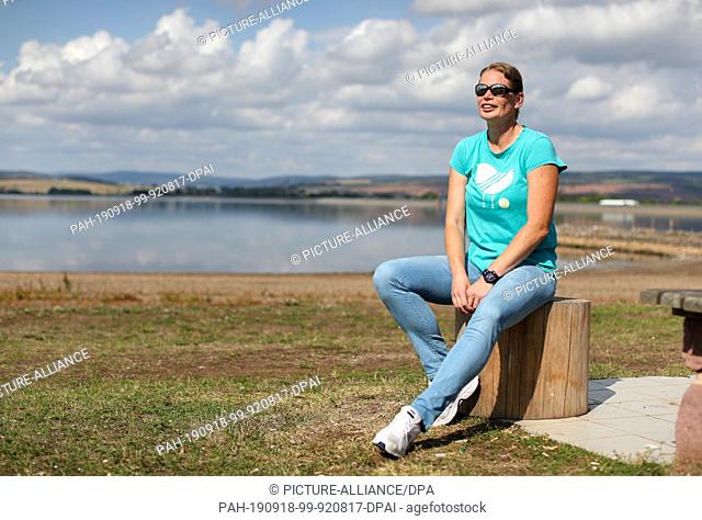 12 September 2019, Saxony-Anhalt, Kelbra: Former shot-putter Nadine Kleinert walks along the Kelbra reservoir. Lack of attractiveness for teenagers