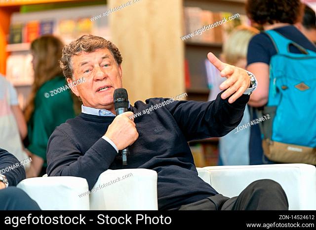 FRANKFURT AM MAIN, Germany - October 19 2019: Otto Rehhagel (*1938, German footballer and manager) talking on stage at 71st Frankfurt Book Fair / Buchmesse...