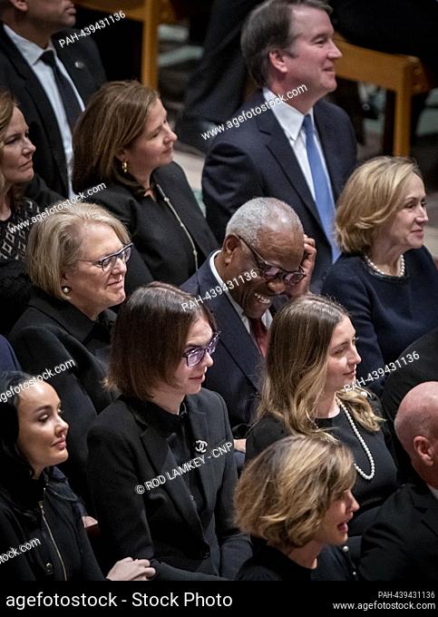 Justice Brett Kavanaugh and his wife Ashley Estes Kavanaugh and Justice Clarence Thomas and his wife Virginia Thomas, attend the funeral service for retired...