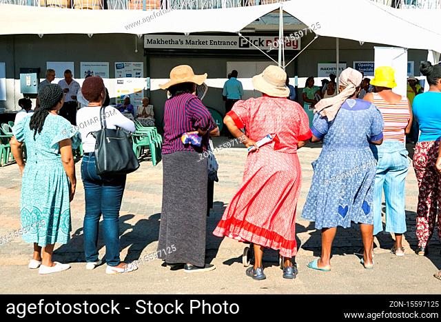 Soweto, South Africa - December 1, 2016: Customers waiting in line at entrance to local Pick n Pay grocery store