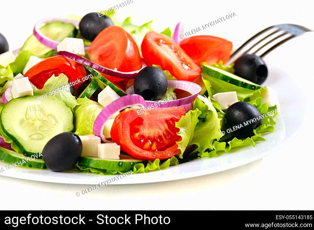 Greek salad in the white plate closeup shot