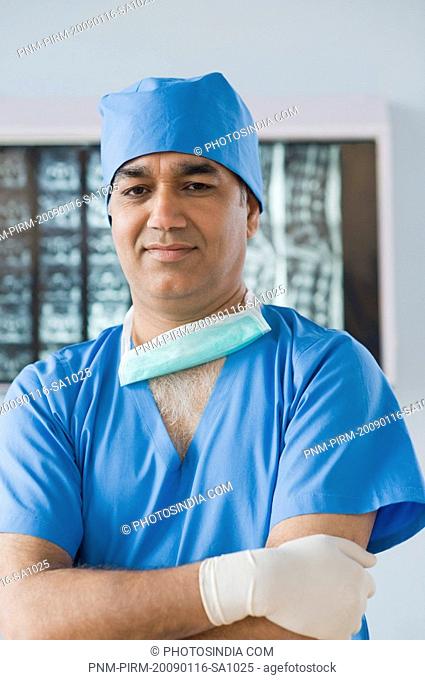 Portrait of a surgeon with his arms crossed, Gurgaon, Haryana, India