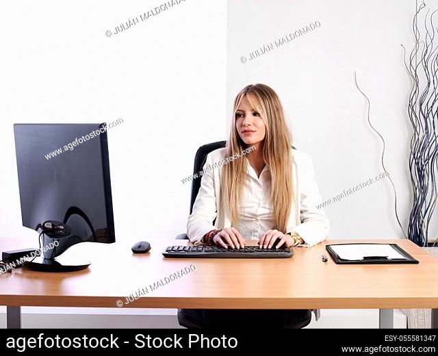 Young business woman at her workplace