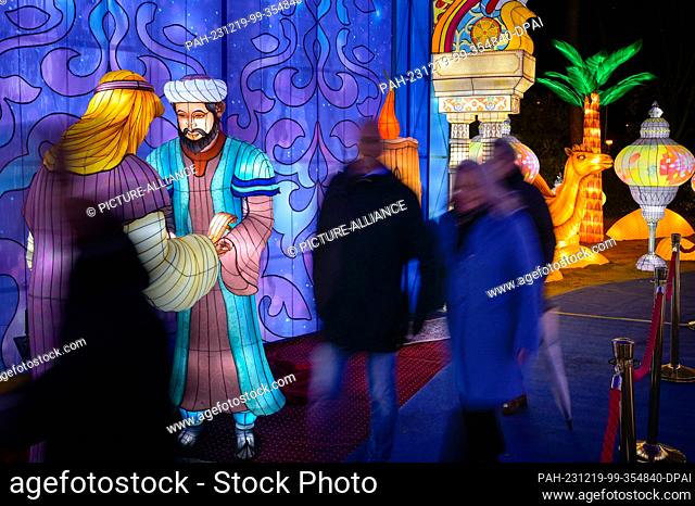 19 December 2023, Saxony-Anhalt, Halle (Saale): A scene in the oriental palace with Scheherazade At Bergzoo Halle, the Magical Worlds of Light whisk visitors...