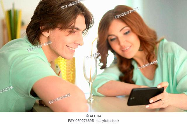 Portrait of a young couple making selfie with smartphone