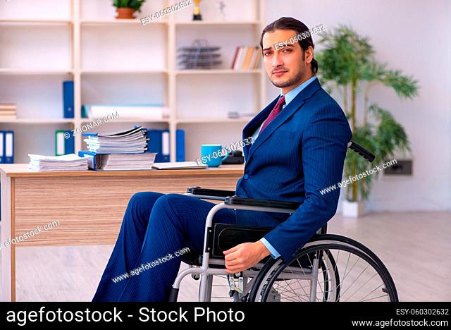 Young male disabled employee working in the office
