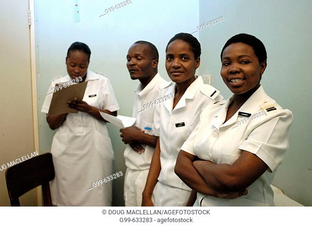 Four nurses pose in an office at the Howard Hospital outpatient department. Some of the nurses attend the training centre
