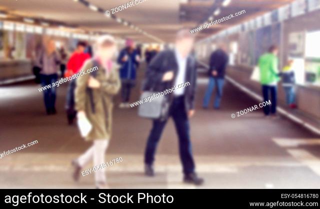Strong blur, anonymous people of Europe at stations and movement to train