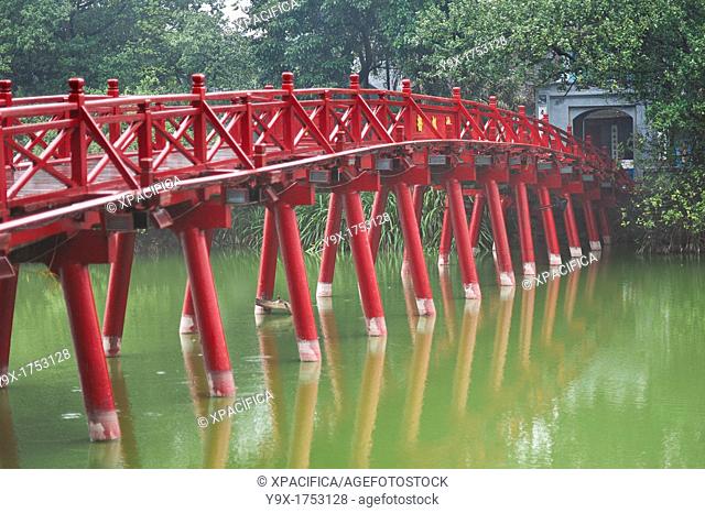 People on the red bridge at the Hoan Kiem Lake in Vietnam