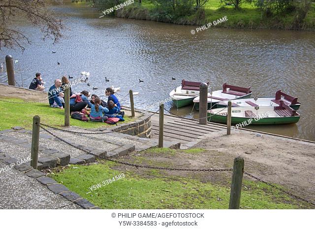 Families picnic beside the Studley Park Boathouse (1863) at Yarra Bend, Melbourne, Victoria, Australia