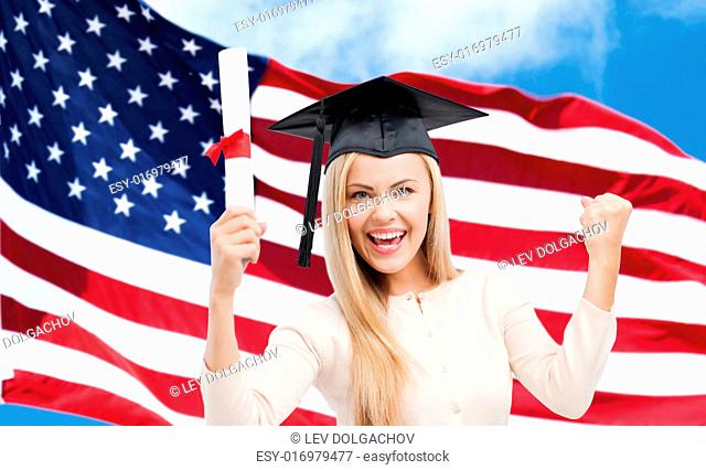 education, high school, knowledge, graduation and people concept - happy student girl or woman in trencher cap with diploma certificate over american flag...