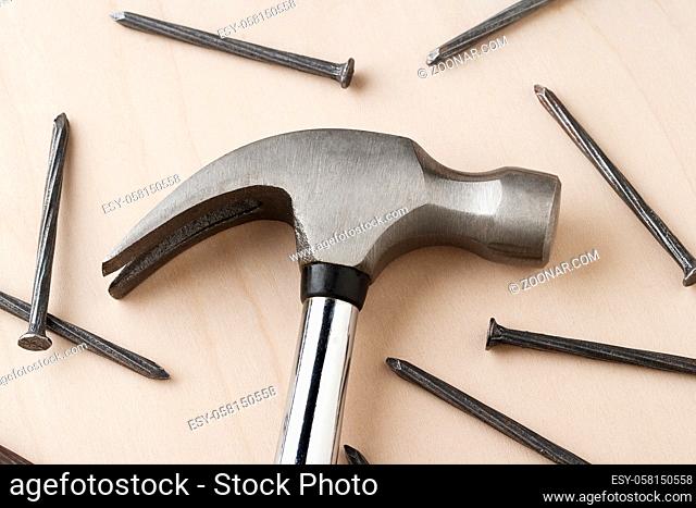 hand hammer and metal nails