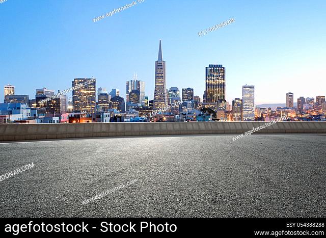 cityscape of san francisco at sunrise from empty road